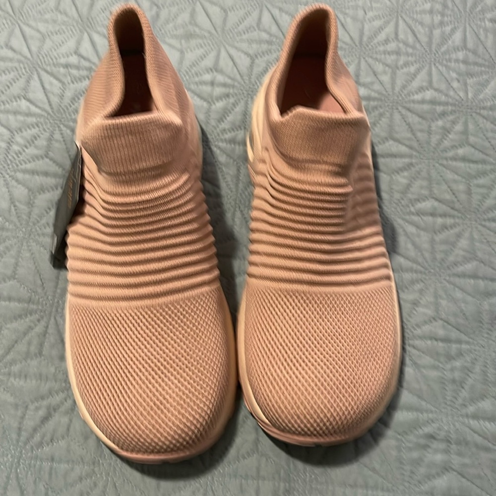 Light Pink slip on walking shoes. Never worn. Still has tags connected.
